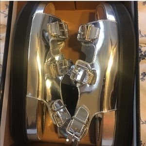 Silver buckled Platform sandals.